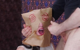 Hot bitch wearing a bag on her head blowing huge dick